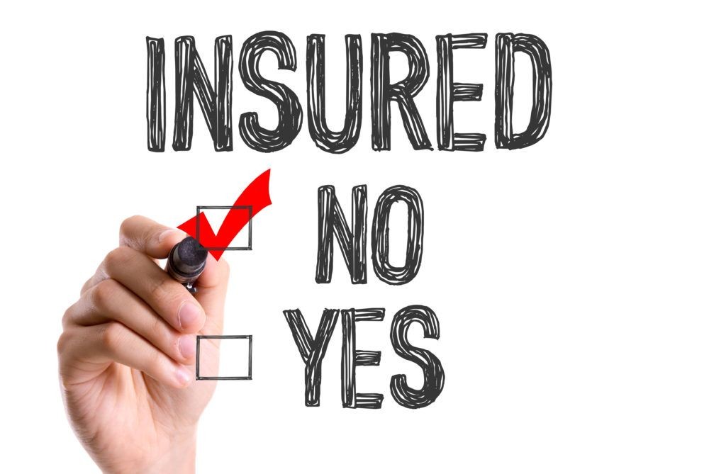 Hand checking 'Yes' on an insurance survey with options 'No' and 'Yes'.